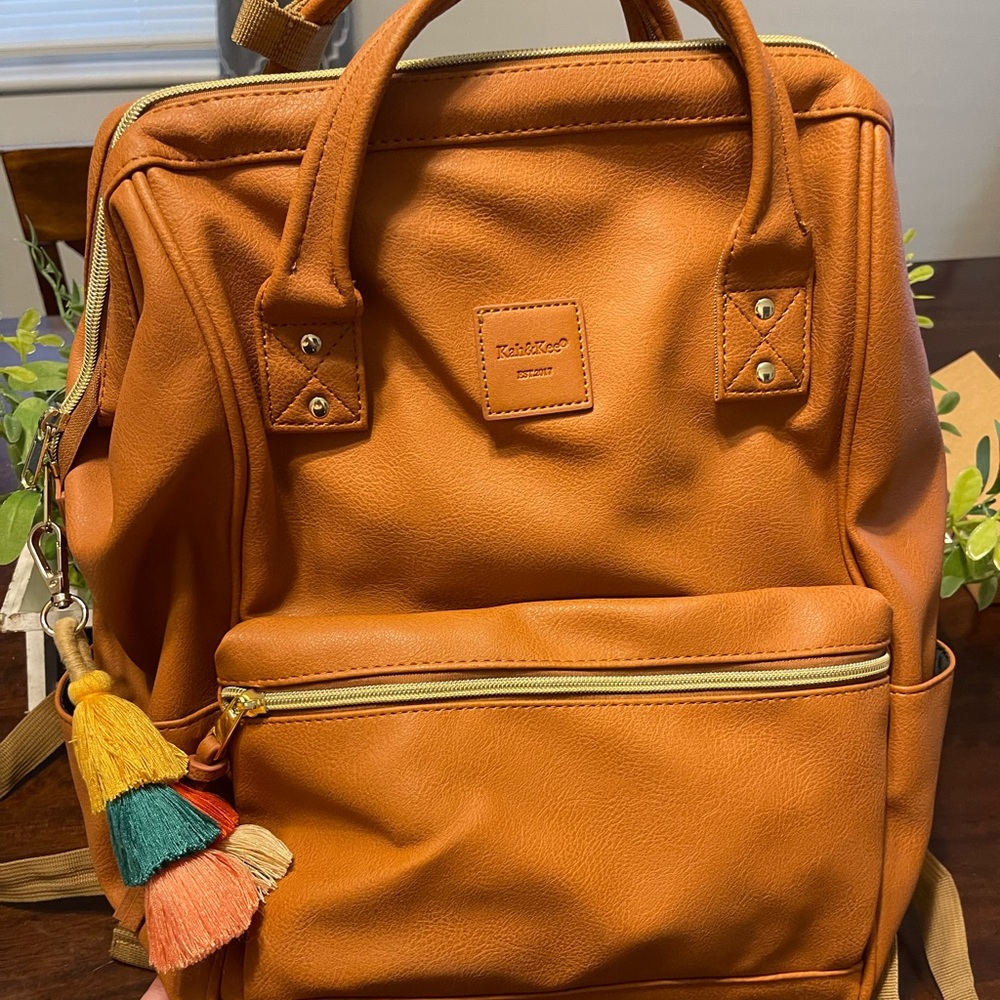 Womens backpack with tassel